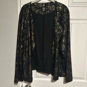 Metallic and black jacket, no closure, good condition